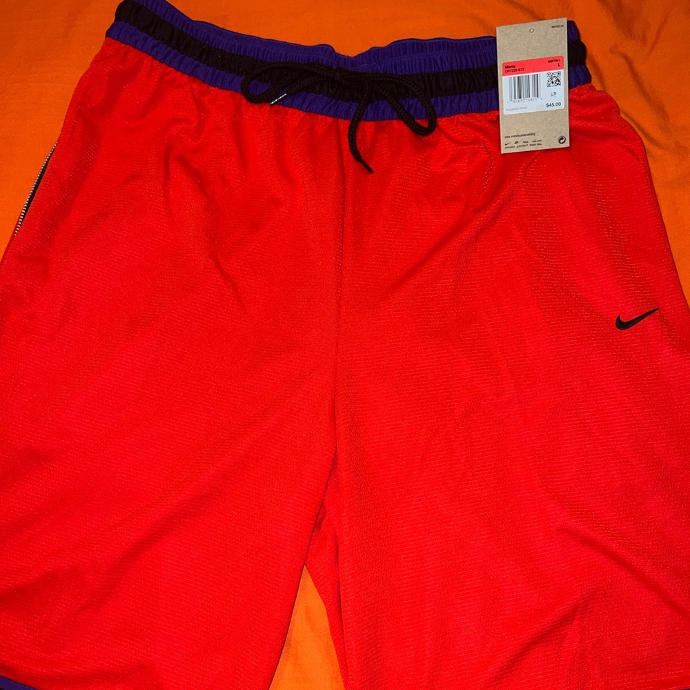 Nike basketball shorts, size large color, red